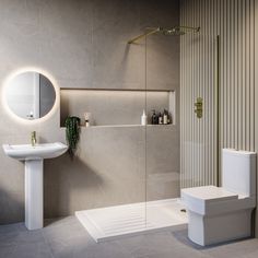 a bathroom with a sink, toilet and shower stall in the corner next to it