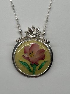 Beautiful pink hibiscus flower blossom set in yellow.  Bezel set in fine silver with a sterling silver beaded chain Yellow Enamel Round Jewelry, Nickel-free Yellow Round Pendant Jewelry, Yellow Enamel Flower Shaped Jewelry, Yellow Flower-shaped Enamel Jewelry, Yellow Enamel Pendant Jewelry, Yellow Sterling Silver Flower Jewelry, Pink Sterling Silver Jewelry With Large Pendant, Pink Hand Painted Flower Jewelry, Hand Painted Pink Flower Jewelry