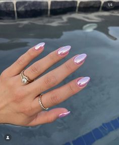 a woman's hand with pink and white manicured nails