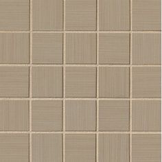 a beige tiled wall with squares and lines