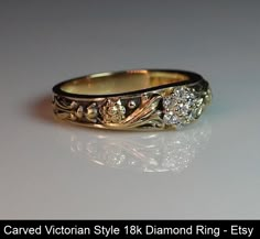 a diamond ring is shown on a white surface with the words carved victorian style 18k diamond ring - etsy