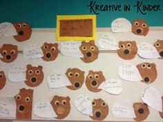 a bulletin board with bear heads and writing on it