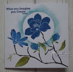 a card with blue flowers on it and the words what you imagine, you create