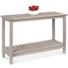 a wooden table with a flower pot on top and shelf below it for storage or display