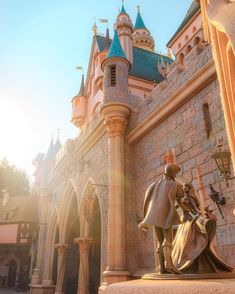 an image of a statue in front of a castle