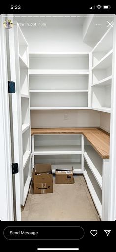 an empty walk in closet with boxes on the floor