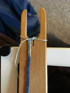 a piece of wood that has some string attached to it