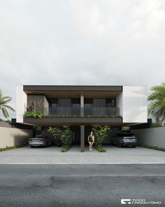 a woman standing in front of a modern house