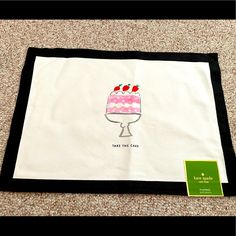 a table cloth with a cake on it and a sign that says, make the cake