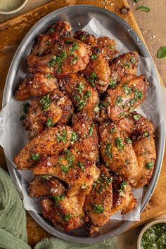 chicken wings with herbs and seasoning in a pan