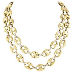 This beautiful and substantial mariner link chain necklace was very well crafted from solid 18k yellow gold with white gold connecting oval links throughout. This 11.6mm wide necklace has a wonderful high-polished finish with a super bold look around the neck, connecting with a sturdy box clasp and dual safety latches ensuring safe and worry-free wear. This long chain measures 36 inches in length and is a truly outstanding and well made necklace that is guaranteed to stand out and make an elegan Gold Multi-strand Chain Necklace In Luxury Style, Gold-tone Double Chain Link Necklace, Luxury Multi-strand Gold Chain Necklace, Luxury Gold-tone Chain Necklace With Polished Finish, Brides Jewelry, Vintage Multi-strand Gold-tone Chain Necklace, Chain Necklace Gold, 18k Gold Chain, Link Chain Necklace