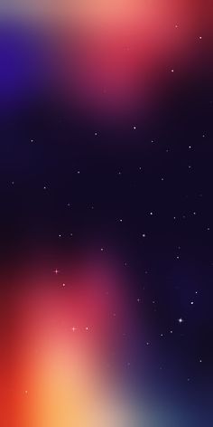 blurry image of stars in the sky with an orange and blue hued background