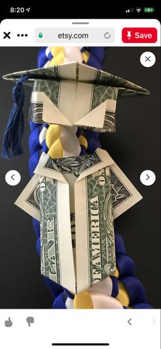 an origami graduation hat made out of money