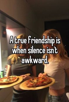 two women holding pizzas with the words a true friend is when science isn't awkward