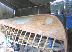 a wooden boat being built in a garage