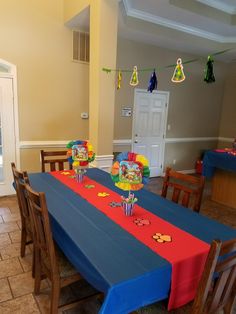 the table is set with mickey mouse decorations