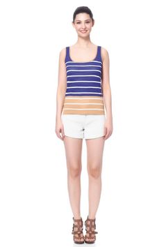 CAN BE WORN 2 DIFFERENT WAYS. Reversible stripe tank top. White/Navy vs. Navy/Gold. DESCRIPTION FABRIC & CARE SHIPPING INFO Reversible knit sweater tank top with stripe detailing. Reverses from navy with white/gold stripes to white with navy/gold stripes Scoop neck Wrinkle resistant Comfortable for warm weather Perfect for layering with a jacket The length for Size Small is 23.5" and the model is 5'10". Viscose/Silk/Cotton/Linen. Dry clean or hand wash cold. Do not bleach, do not tumble dry. Neck Wrinkles, Tank Top White, Reversible Vest, Saving Time, Sweater Tank Top, Navy Gold, Gold Stripes, Packing Light, Striped Tank Top