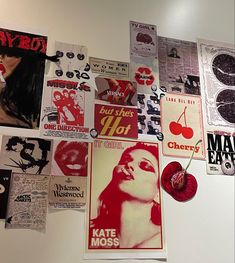 a wall covered in posters and stickers