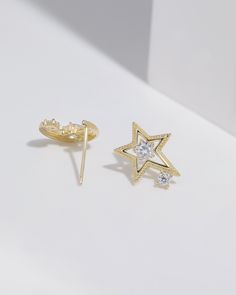 Material: High-Quality Solid 925 Sterling Silver (Nickel-Free and Lead-Free) Earrings come with matching color sterling silver and plastic backings Stones: Cubic ZirconiaColor: Silver and GoldStar Dimension: 0.5 x 0.4 Inches Approximately (Length x Width)Moon Dimension: 0.45 x 0.4 Inches Approximately (Length x Width) Packaging: Complimentary Gift Box and Jewelry Pouch Processing Time: Each item is handmade with love as we receive orders. Our production time is 2 to 5 business days. We will ship White Star-shaped Cubic Zirconia Earrings, Star-shaped Sparkling Earrings For Anniversary, Star-shaped Cubic Zirconia Earrings For Party, Star-shaped Cubic Zirconia Jewelry With Matching Earrings, Star Shaped Cubic Zirconia Earrings For Party, Sparkling Star-shaped Earrings For Anniversary, Star-shaped Cubic Zirconia Jewelry For Party, Silver Star-shaped Cubic Zirconia Earrings, Silver Star-shaped Diamond Earrings For Gift