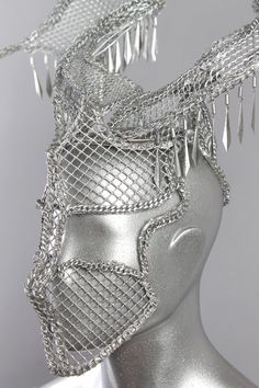 This is a one of a kind piece of wearable art made for the Five and Diamond Sixth Annual Headgear Art Show and shown on August 2, 2018. Designed and handmade by the artist: Omar António Materials: Metal mesh. Galvanized wire. Chain. Jewelry. Paint. Light weight One of a kind. Mad max beyond thunderdome. Headpiece All headgear sales are final. Due to the unique nature of these works of art, coupon codes will not be accepted. td {border: 1px solid #ccc;}br {mso-data-placement:same-cell;} Handmade Silver Headpieces For Party, Metal Head, Unique Nature, Mad Max, Leather Conditioner, Metal Mesh, Chain Jewelry, Art Show, Festival Bra