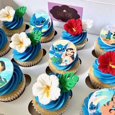 cupcakes decorated with cartoon characters and flowers