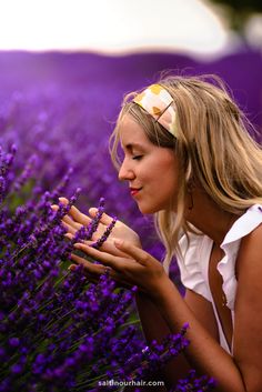 a woman in a field of lavender flowers