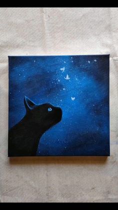 a painting of a black dog with stars in the sky above it on a canvas