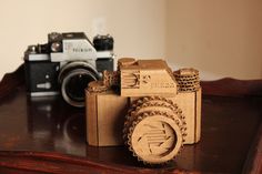 a wooden camera sitting on top of a table