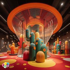 an indoor area with colorful cactus decorations and lights