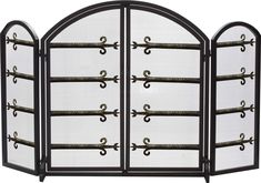 an iron fireplace screen with three arched doors