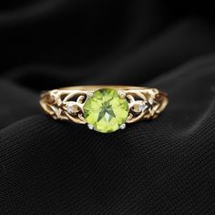 Product Details Keep it classy and chic by getting this elegant Antique Peridot Ring embellished with Round Shape Peridot in Prong Setting and Round Shape Diamond Stones. This Peridot and Diamond Ring is crafted with Gold and will give you a charming look. Get this Peridot Ring for her, surprise her on her birthday and make her special more memorable. Product Information SKU SHP-RINGS0821187798 Width 6.3 mm Height 7 mm Weight 2.08 gm (Approximate) PERIDOT INFORMATION No.of Stones 1 Pieces Total Surprise Her, Ring With Diamond, Keep It Classy, Signature Jewelry, Peridot Ring, Timeless Jewelry, Rings For Her, Conflict Free Diamonds, Diamond Stone