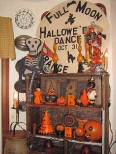 a halloween display with pumpkins and decorations