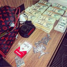 the purse is full of money, keys and other items on top of a table