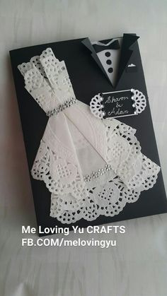 a black and white card with lace on it