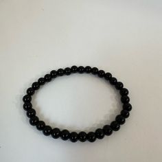 This Is A Handmade Black Bracelet. This Bracelet Would Be Nice To Wear With Almost Anything To Add A Bit Of Color To An Outfit. This Bracelet Is Fitted And Won't Move Around Much When You Are Wearing It. Bundles And Reasonable Offers Welcome! Handmade, Silver, Silvery, Blueish Silver, Purple, Dark Purple, Feminine, Girly, Cute, Girlhood Core, Girlhoodcore, Pretty, Casual, Spring, Summer, Fall, Winter, Every Day, Simple, Vacation, Colorful, Multicolored, Goth, Dark, Minimalist, Minimal Girlhood Core, Dark Minimalist, Black Beaded Bracelet, Black Beaded Bracelets, Purple Dark, Black Bracelet, Black Bracelets, Casual Spring, Casual Black