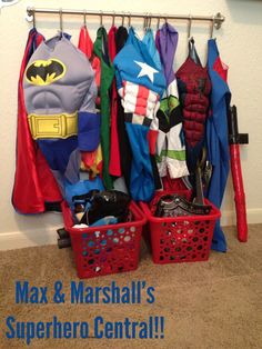 the closet is filled with children's clothing and toys, including batman capes