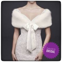 a woman in a white dress with a fur stole on her shoulder and the words david's bridal