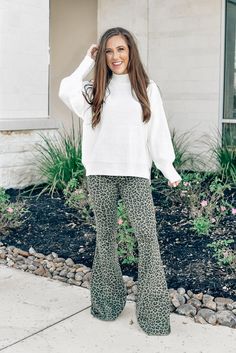 Be a showstopper in these olive leopard flare pants! Don't be afraid to stand out this holiday season, add these unique pants to your closet! Perfect to pair with cream sweaters, beanies and booties! Olive leopard pants Stretchy waist band No zipper or button closure Pull-on pants Flare bottoms If bottoms are too long, cut the edges and they will shape nicely Runs true to size Pair with our Snowfall Snuggles Sweater in Cream Piper is 5'3, wears a 1-3 in pants and is wearing a Small! Cream Sweaters, Leopard Flares, Flare Bottoms, Unique Pants, Leopard Pants, Cream Sweater, Pull On Pants, Be Afraid, Newborn Photos