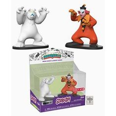 two figurines are shown in front of a box with the same character on it