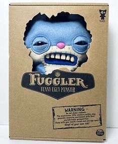 a box with an image of a blue monster head on it's face and the word