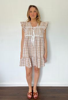 This season's biggest trend? Gingham! Cute and comfortable, this flowy gingham dress is the perfect throw-on for a casual look. Perfect for your next event or vacation! It is a true to size fit, Annalee wears the size Medium. Details: 97% Polyester 3% Spandex Lined Side Seam Pockets Double front ties Layering Tanks, Cardigan Top, Gingham Dress, Plaid Dress, Pitcairn Islands, British Indian, Mozambique, Tank Dress, Gingham