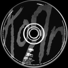 a black and white photo of a cd disc