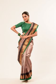 Discover the classic elegance of our Pink Pure Gadwal Silk Saree with intricate Butas and a striking Dark Green Zari Border and Pallu - a perfect blend of traditional charm and contemporary allure. Elegant Pre-draped Saree With Tilla For Diwali, Elegant Cotton Silk Pre-draped Saree For Festivals, Elegant Multicolor Cotton Silk Pre-draped Saree, Elegant Cotton Silk Pre-draped Saree For Transitional Season, Elegant Fitted Pre-draped Saree With Zari Weaving, Elegant Silk Pre-draped Saree For Transitional Season, Elegant Pre-draped Saree For Transitional Season, Transitional Pre-draped Elegant Saree, Elegant Art Silk Pre-draped Saree With Cutdana