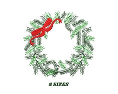 a red bird sitting on top of a green wreath with the word 5 sizes written below it