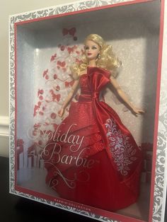 a barbie doll in a red dress with white trim