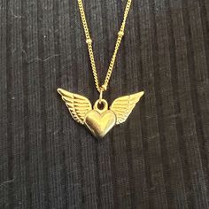 "Memory necklace, memorial jewelry, gold guardian angel wings necklace. A beautiful and unique way to honor the life of a loved one who has passed away. This is a gorgeous necklace that will forever remind you of your special angel looking over your shoulder. ❤ 𝗠𝗘𝗔𝗦𝗨𝗥𝗘𝗠𝗘𝗡𝗧𝗦 ❤ Pendant height: 0.39''/1 c\"m. Pendant width: 0.79\"/2 c\"m. Please choose your preferred length from the list above. ❤𝗠𝗬 𝗦𝗧𝗢𝗥𝗘❤ For more necklaces for women: https://etsy.me/3hhni0o Back to my shop: http Unique Gold Necklace For Memorial, Angelic Gold Necklaces For Gifts, Guardian Angel Wings, Elegant Gold Necklace With Angel Wings, Elegant Angel Wings Necklaces, Memory Necklace, Angel Wings Necklace, Elegant Heart-shaped Angel Wings Necklace, Wings Necklace