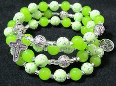 "This Five decade Rosary bracelet is make out of Mint Green druk beads, Acrylic and metal beads.   Preciosa® Czech beads are pressed dipped décor glass druk, mint, 8mm round.  Glass making is an age-old industry in the Czech Republic. Druk is the Czech name for beads that are made of smooth, round, pressed glass. \"Dipped Décor\" druk beads are hand-dipped in designer colors for a soft, elegant look.    Acrylic beads of dazzling silver \"rhinestones\" offer sparkling accents to the bright, punch Memory Wire Wrap Bracelets, Decade Rosary, Glass Making, Rosary Bracelet, Wire Wrapped Bracelet, Memory Wire Bracelets, Green Quartz, Memory Wire, Green Gemstones