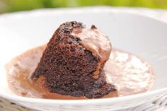 a piece of chocolate cake in a white bowl