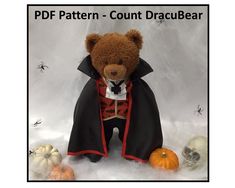 a teddy bear dressed up in a costume surrounded by skulls and pumpkins with the caption pdf pattern - count dracula