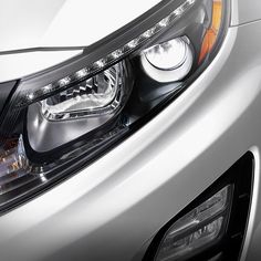 the headlight of a silver car is shown